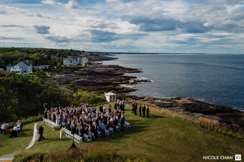 An aerial view of a wedding ceremony with a string quartet providing the wedding ceremony music.