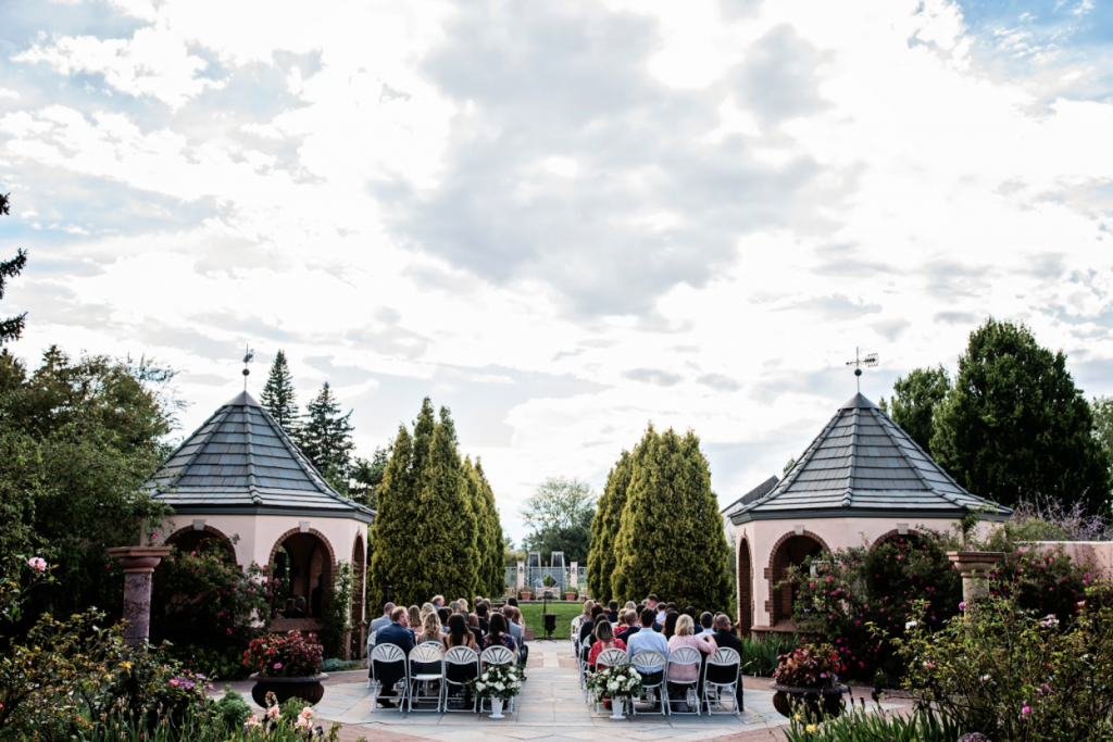 Guests enjoy a string quartet as they watch a wedding ceremony.